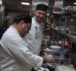 Carolina Meadows Executive Chef Cory Mattson, right, works with staff member Arnaldo Prieto.