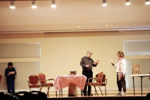 Members of the Carolina Meadows Playreaders group practice in the auditorium