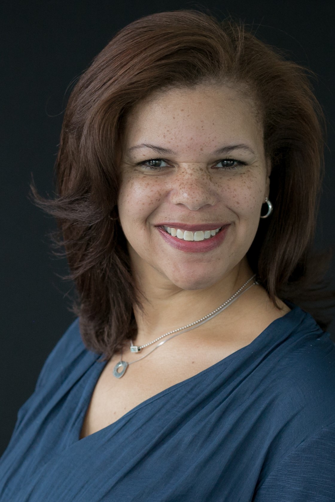 A headshot of Adele Dowell